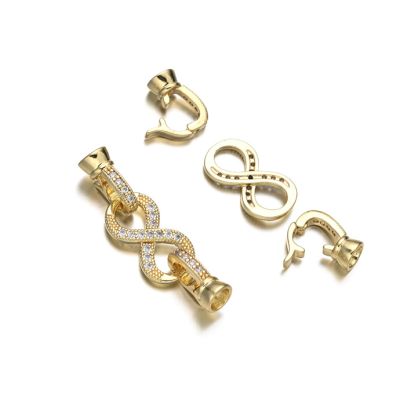 Broche Latón Dorado AAA e-coating Infinito Brillantes 30mm K1106. Venta por Unidad